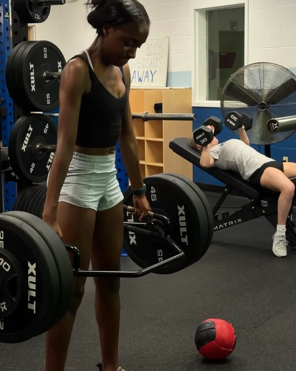 High school athletes completing different coached strength exercises