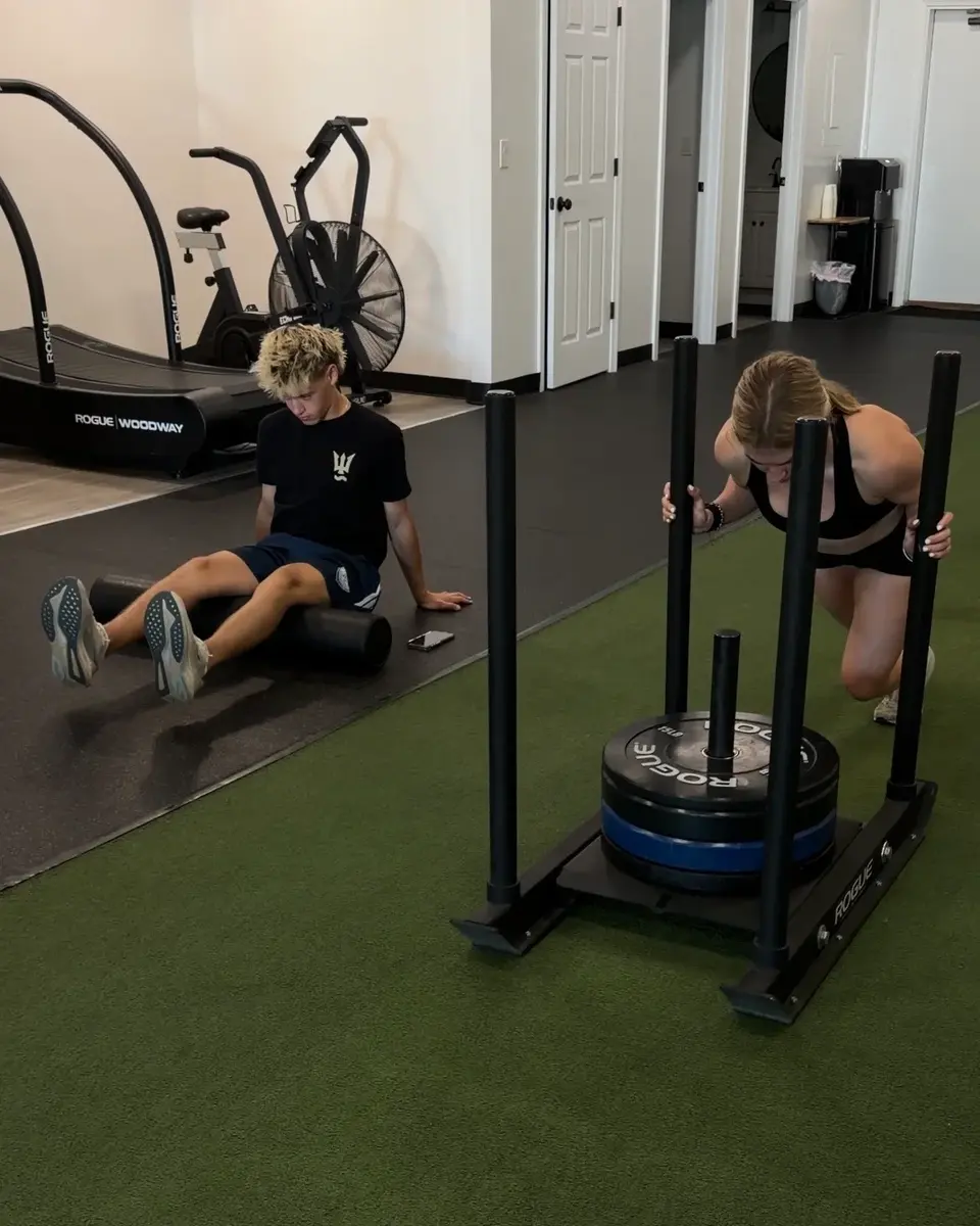 High school athletes completing individualized training together