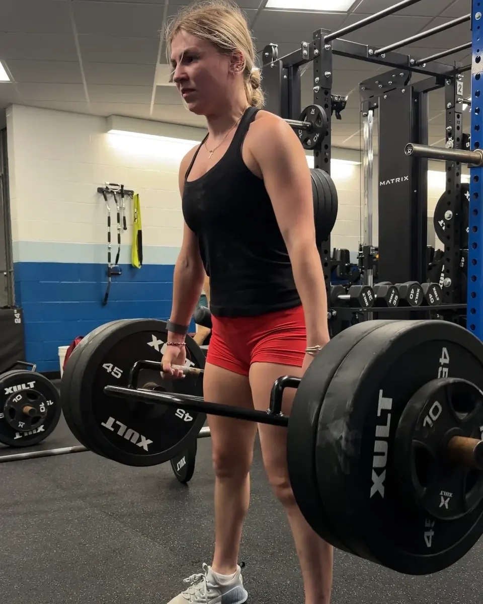 Athlete completing coached strength training